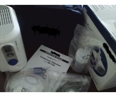 Nebulizador con compresor nuevo con accesorios útil para pacientes asmáticos .